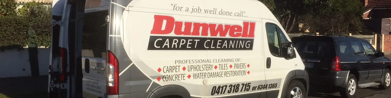 Dunwell Carpet Cleaning van parked outside residential properties in Launceston